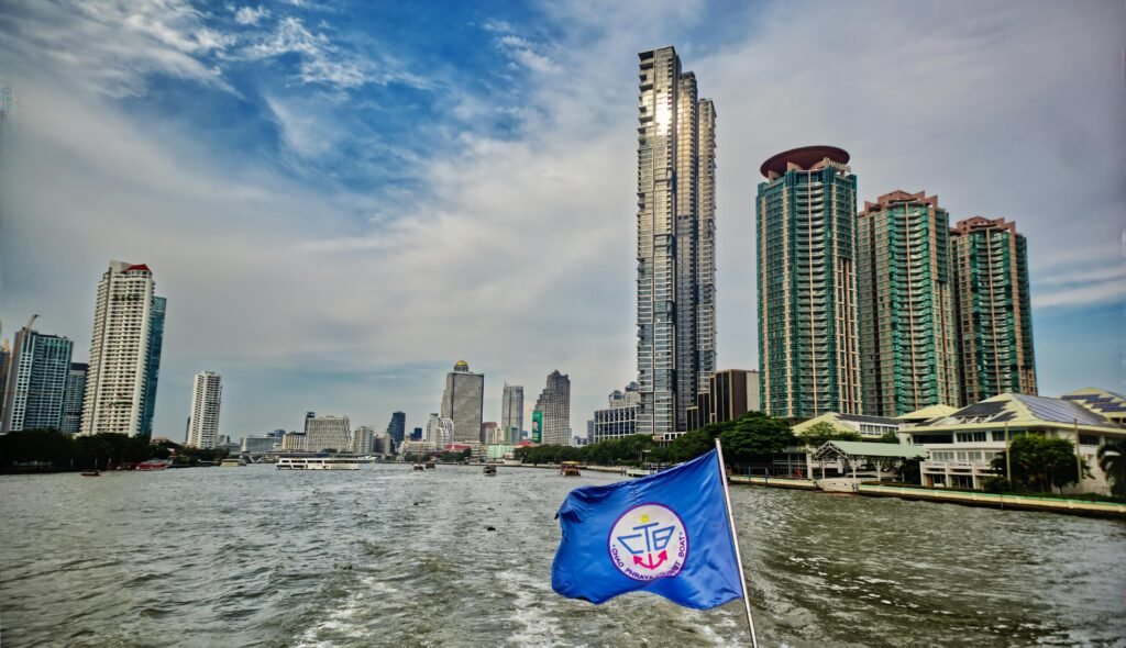 A picturesque view of Bangkok skyline from a river ferry on Chao Phraya River, Thailand.